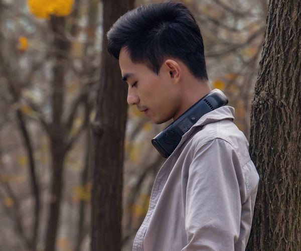 Close up of a man balancing on one leg in gym.